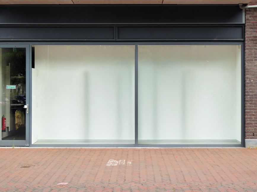 The bright, sunny storefront of a successful modern local business, representing growth achieved through expert SEO strategies.